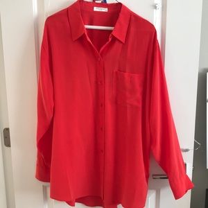 Red colored button down blouse